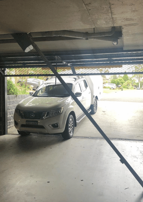 garage door with a car parked outside